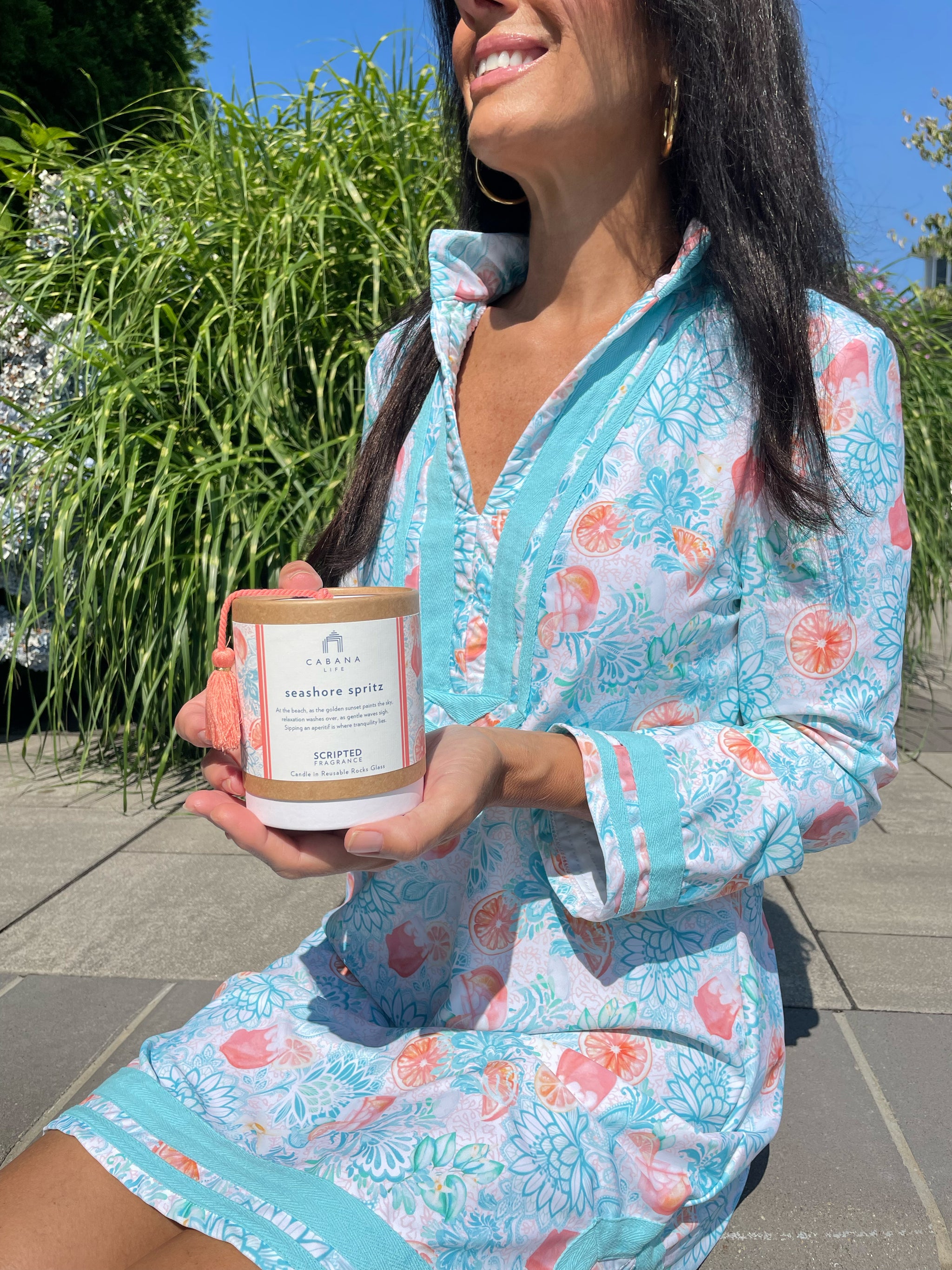Pour on the charm with a citrus-infused Seaside Spritz candle and a breezy Cabana Life wrap dress for the perfect vacation gift set.
