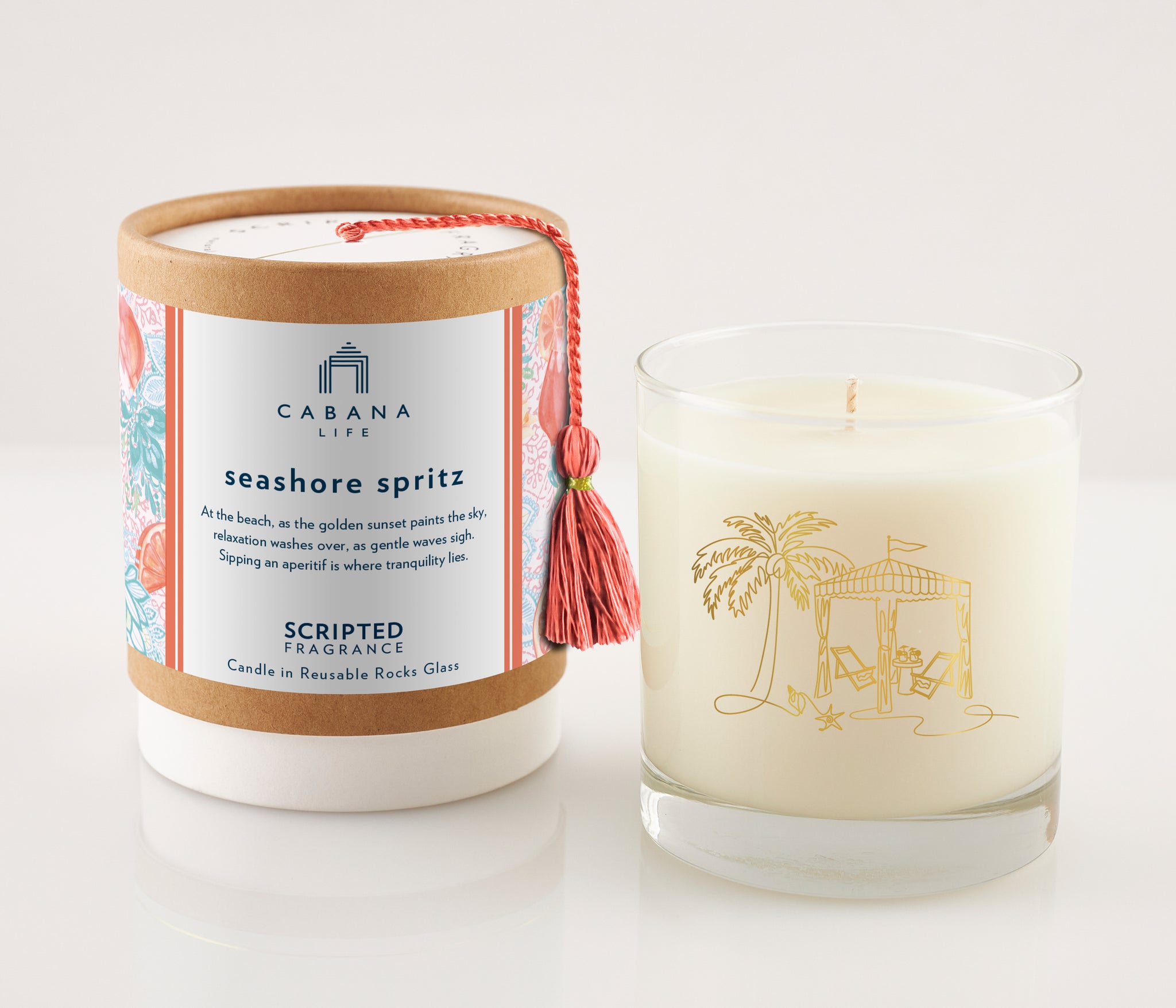 Sparkling and citrusy, the Seaside Spritz candle is housed in a 22k gold-trimmed rocks glass—perfect for pairing with Cabana Life’s coral-toned resortwear.