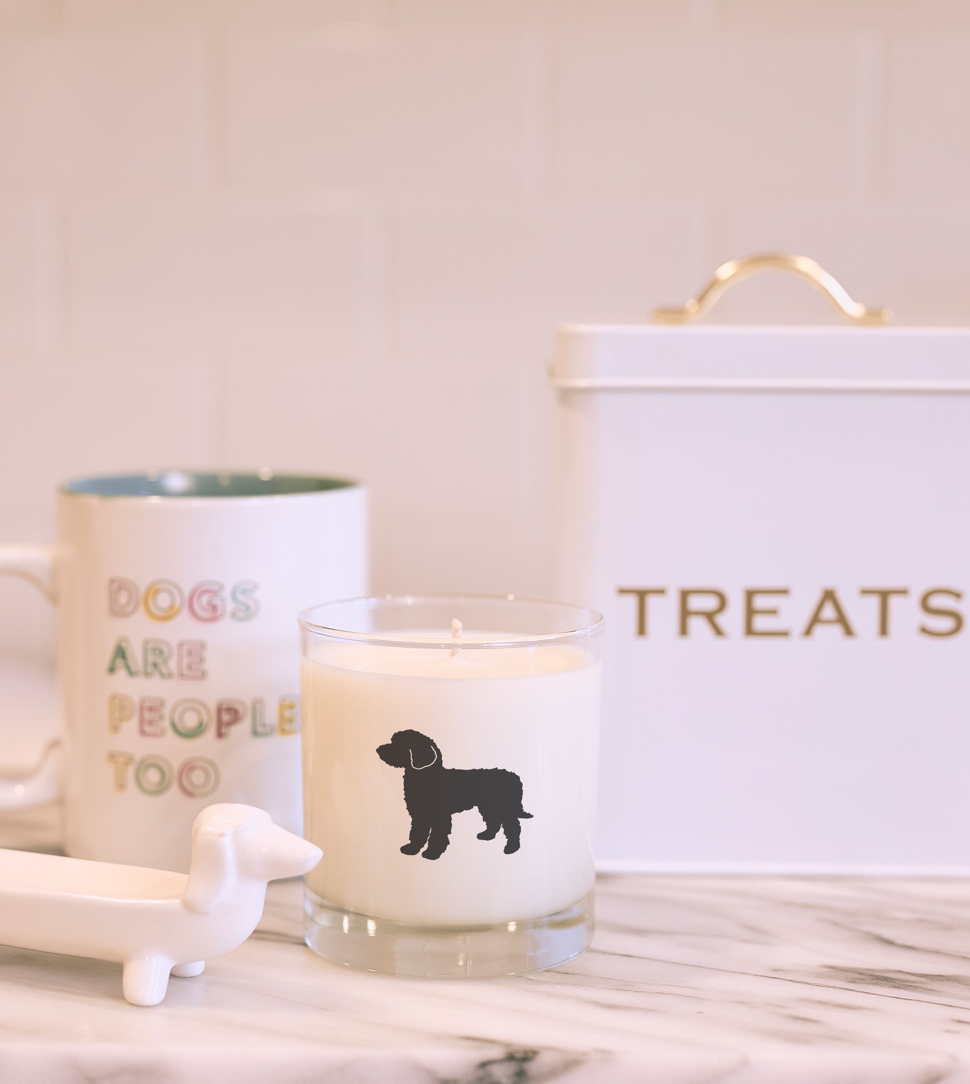 Neutral home scene with reusable candle and goldendoodle charm