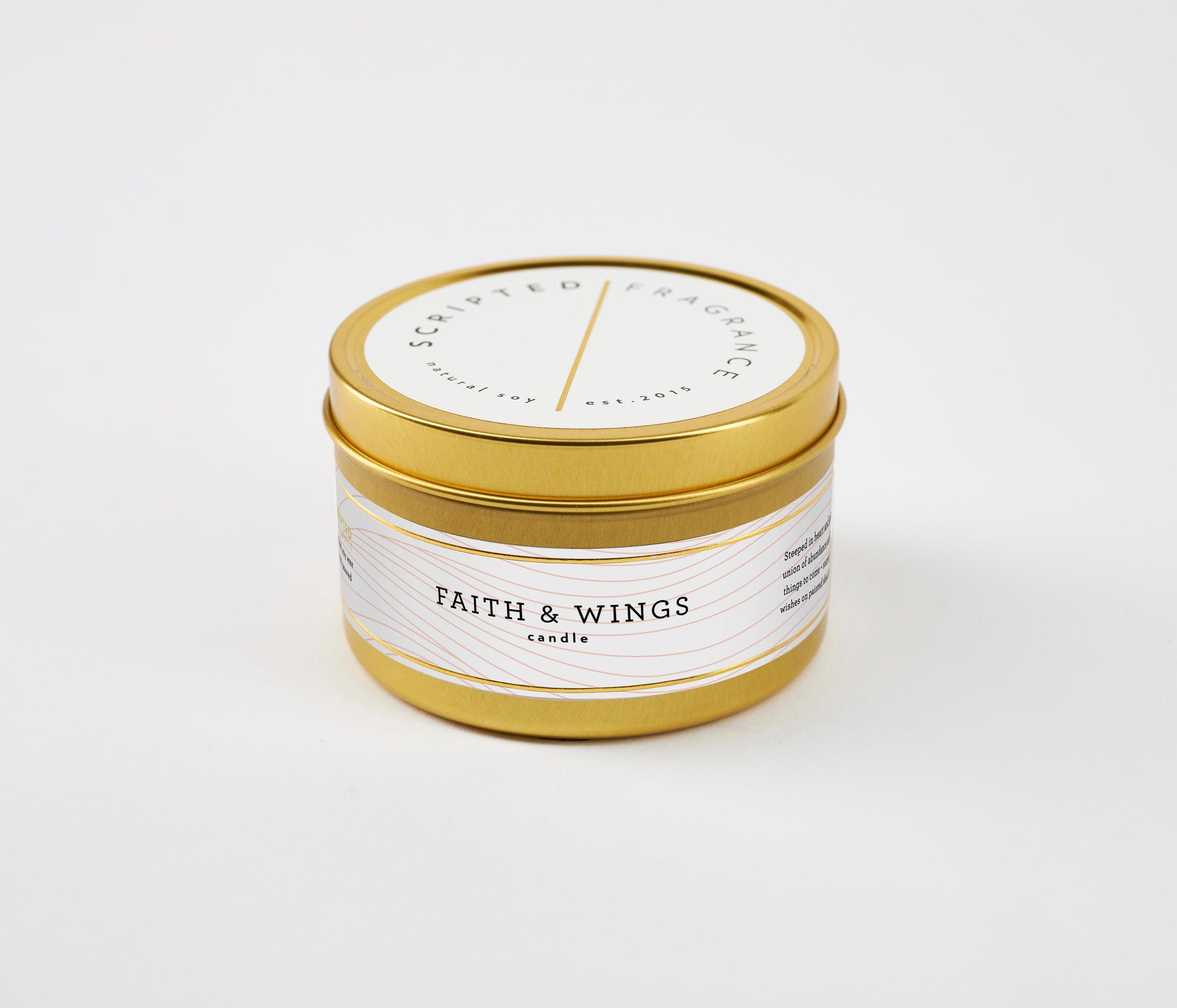 Faith & Wings candle in compact gold tin – champagne, sugar, and floral scent for an on-the-go inspiration gift.