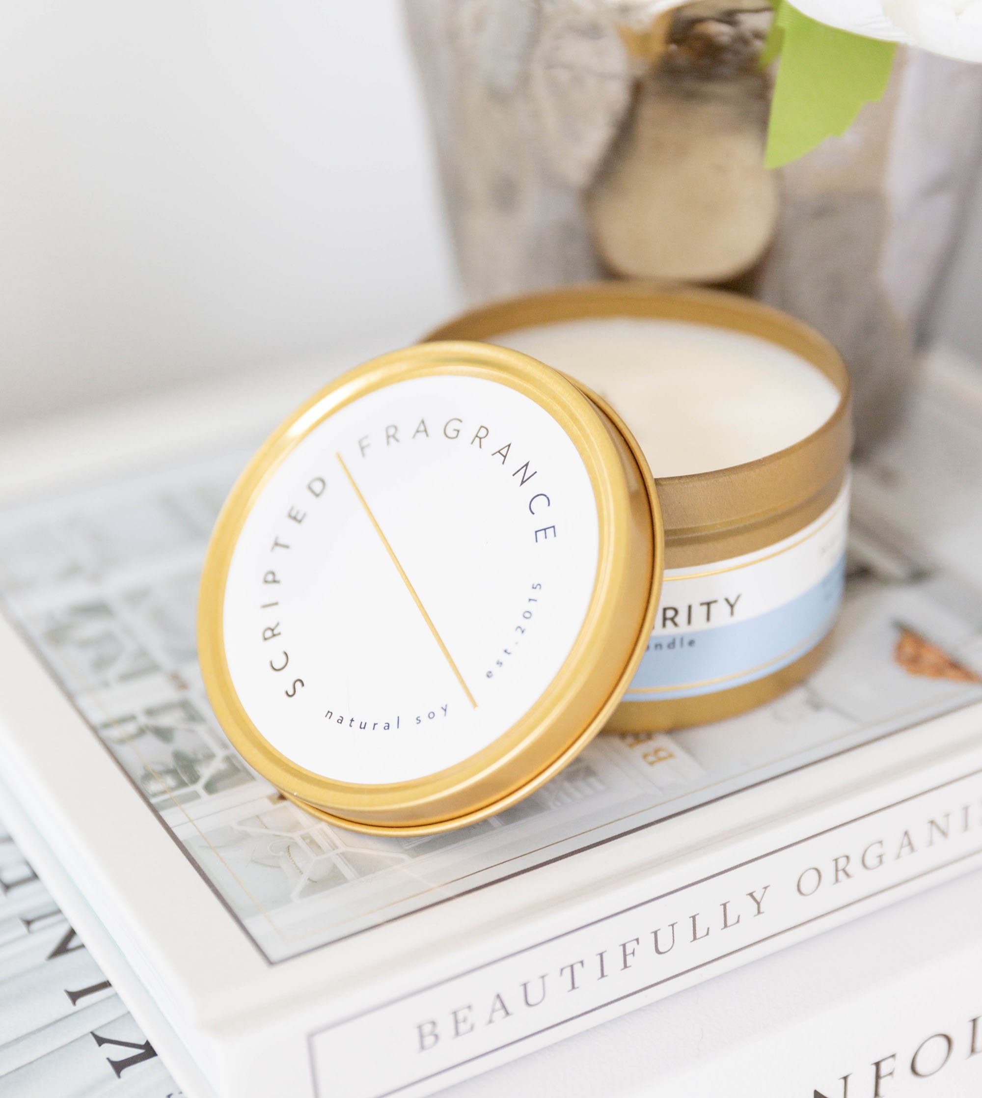 Clarity candle in gold tin with clean label – perfect for travel or thank-you gifts