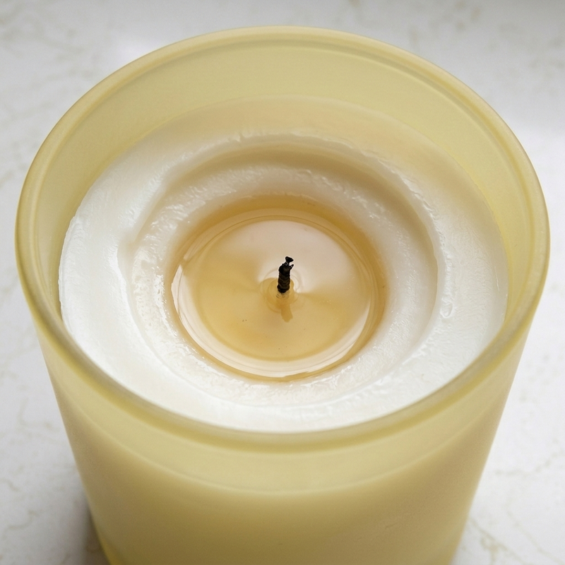 Scripted Fragrance 100% soy candle burning with a clean, even flame