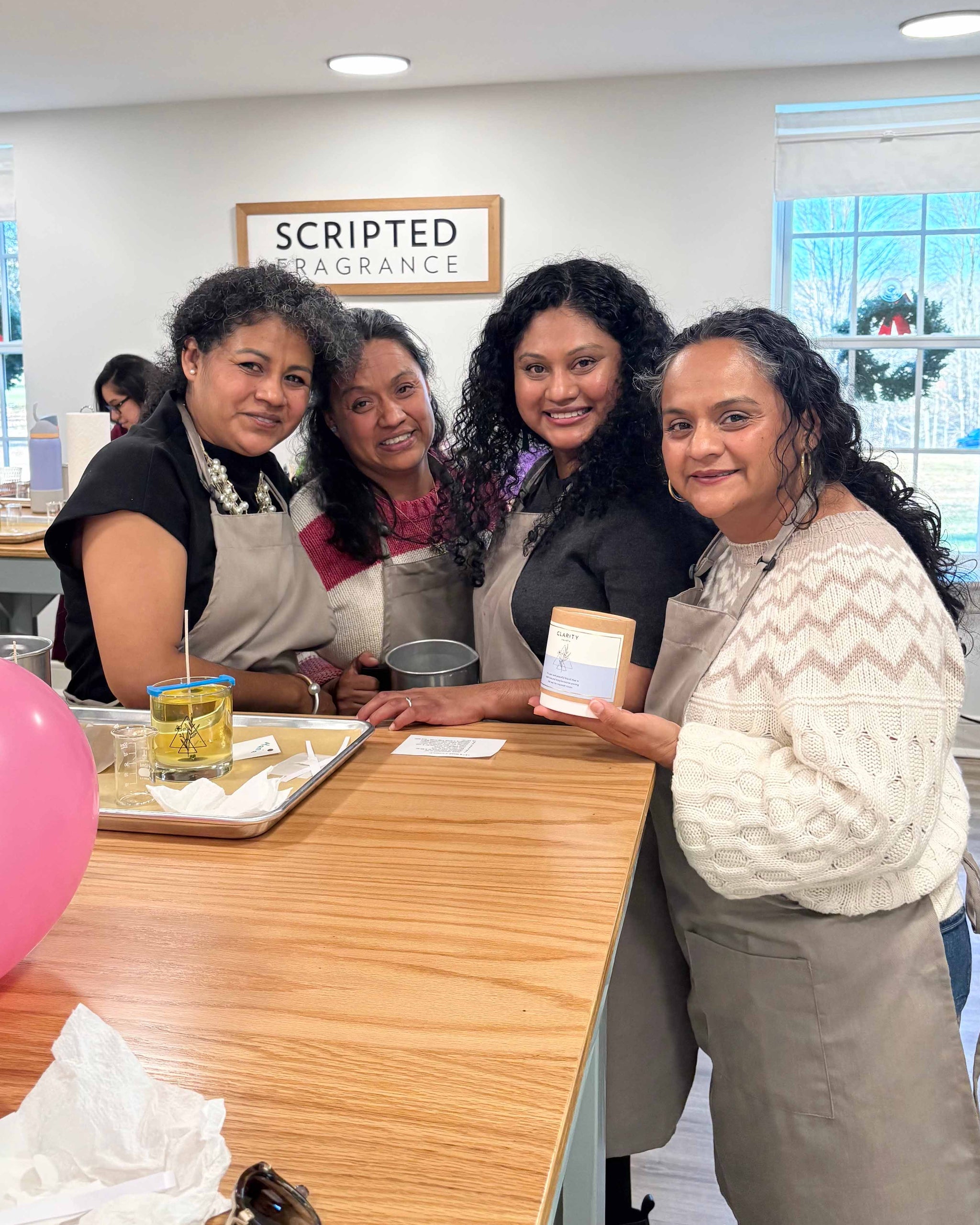 Friends taking a candle-making class together at Scripted Fragrance