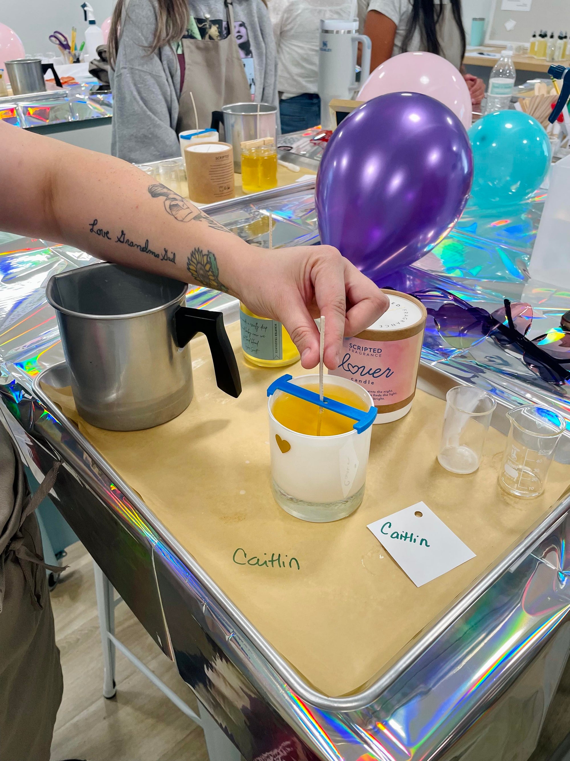 Bachelorette party guests hand-pouring soy candles