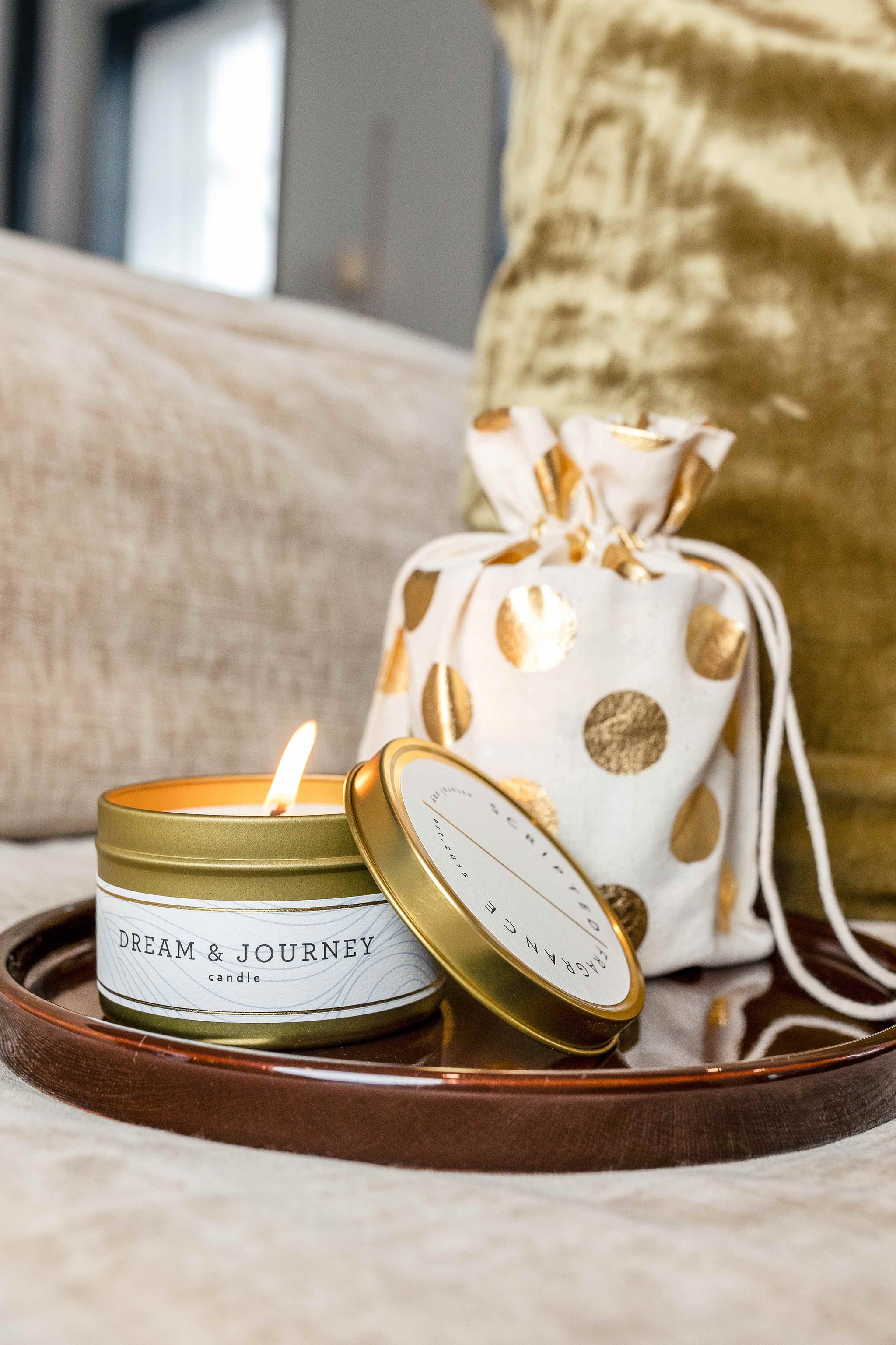 Dream & Journey candle with bold green tea notes in gold travel tin– a thoughtful encouragement or graduation gift.
